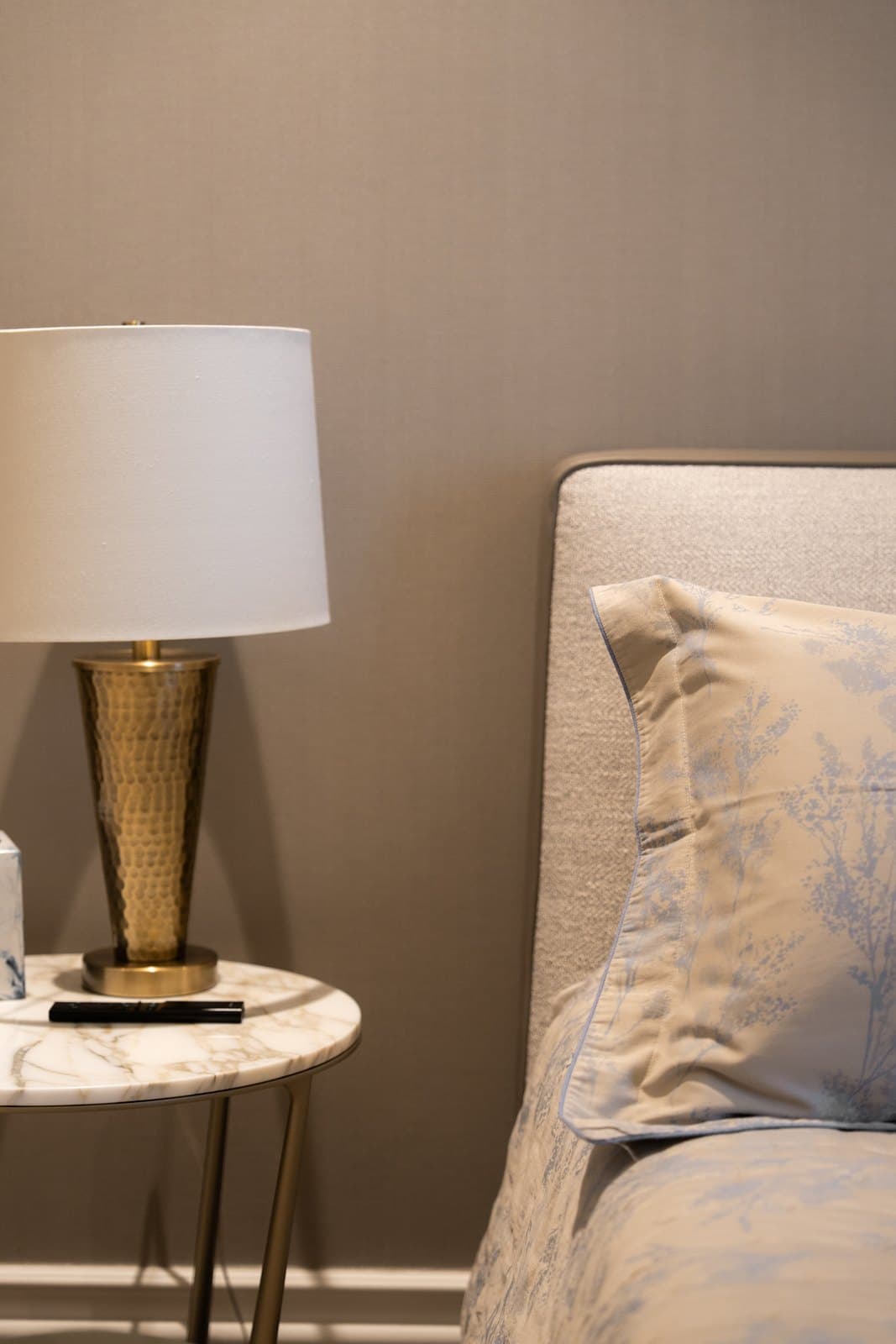 Brass lamp on a marble side table