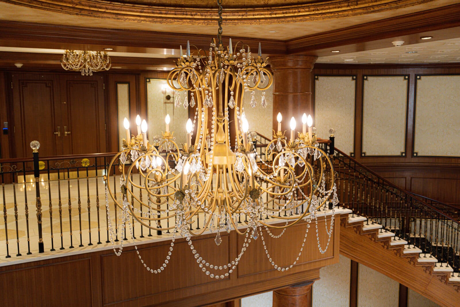 Crystal chandelier over the curved stair in the double height lobby