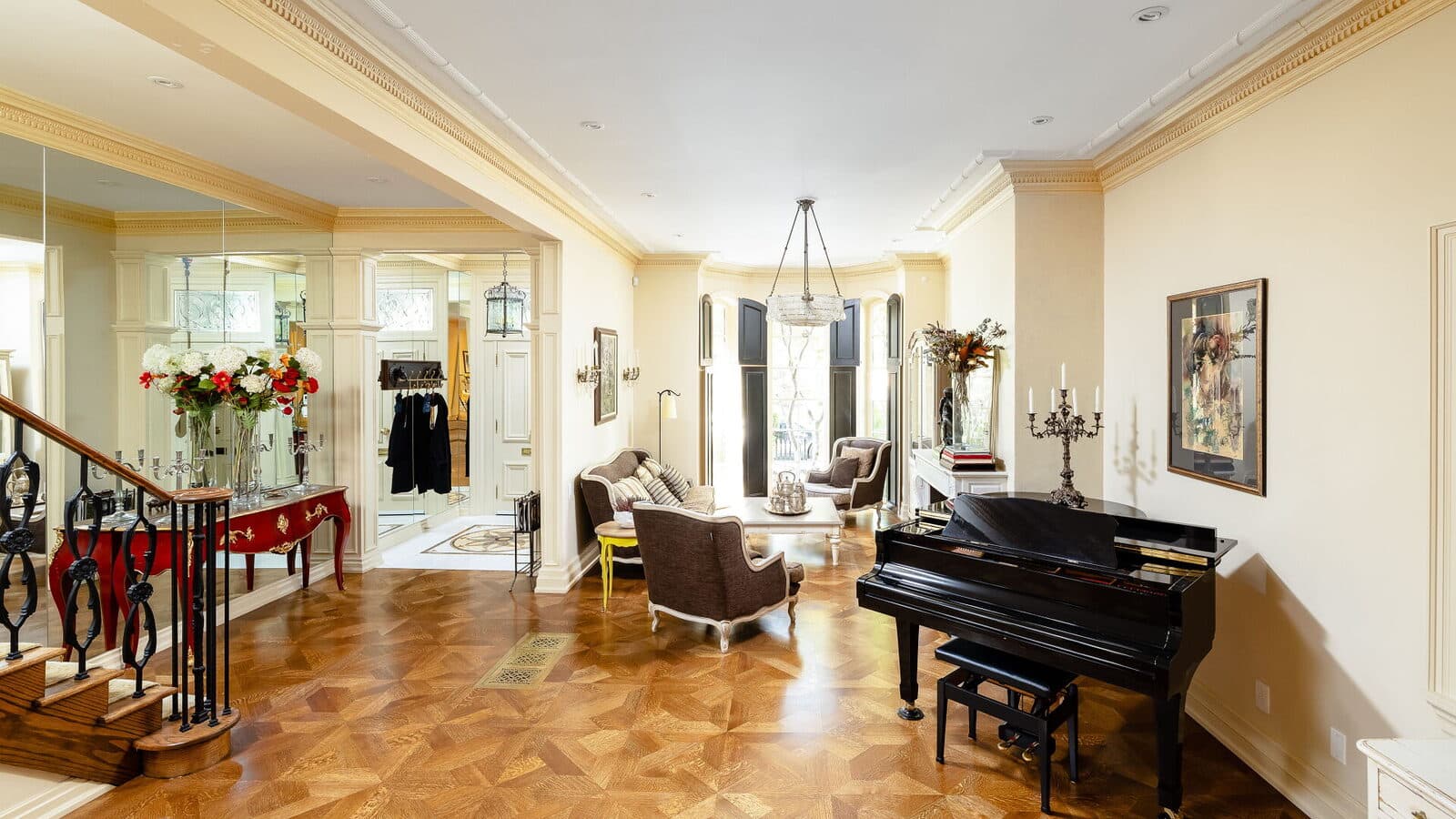Living room with a grand piano and a mirrored hall beyond
