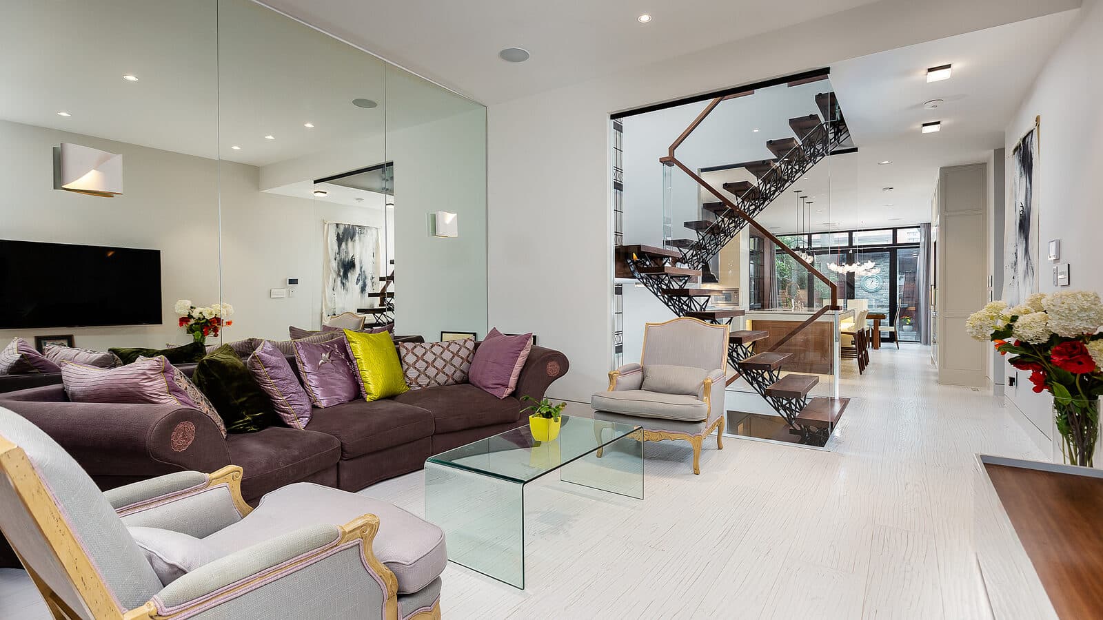 Living room with a sightline through to the floating stair