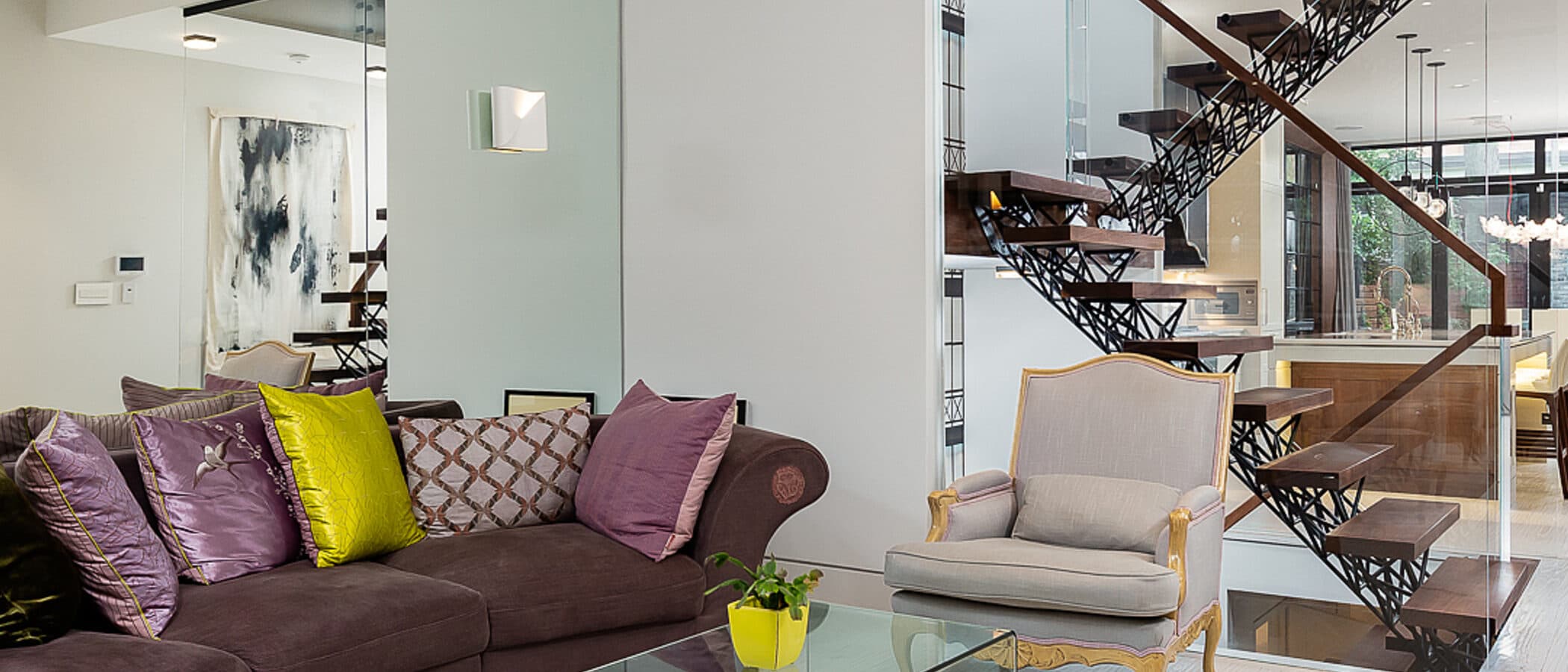 Living room with a sightline through to the floating stair
