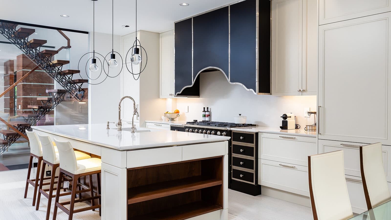 Kitchen from the reverse angle with the glazed stair wall beyond
