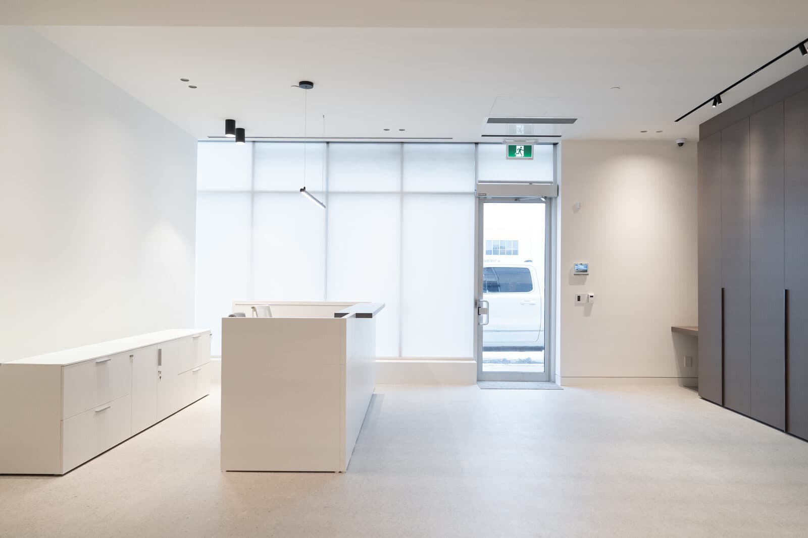 Reception and entry with a storefront glass door
