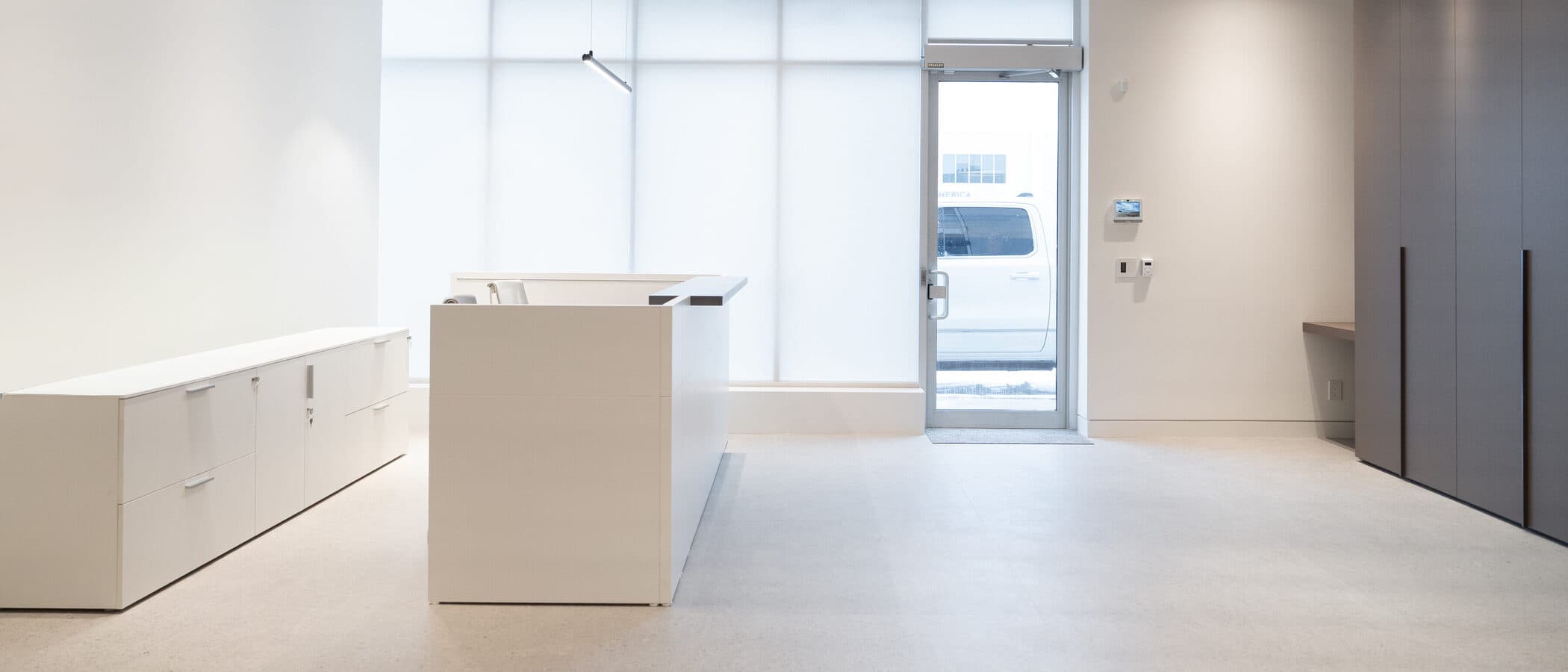 Reception and entry with a storefront glass door