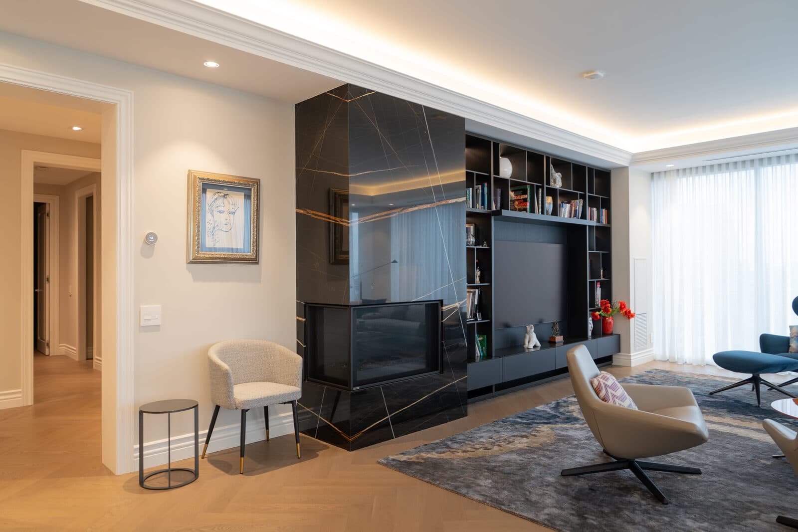 Black marble fireplace and media wall in the living room