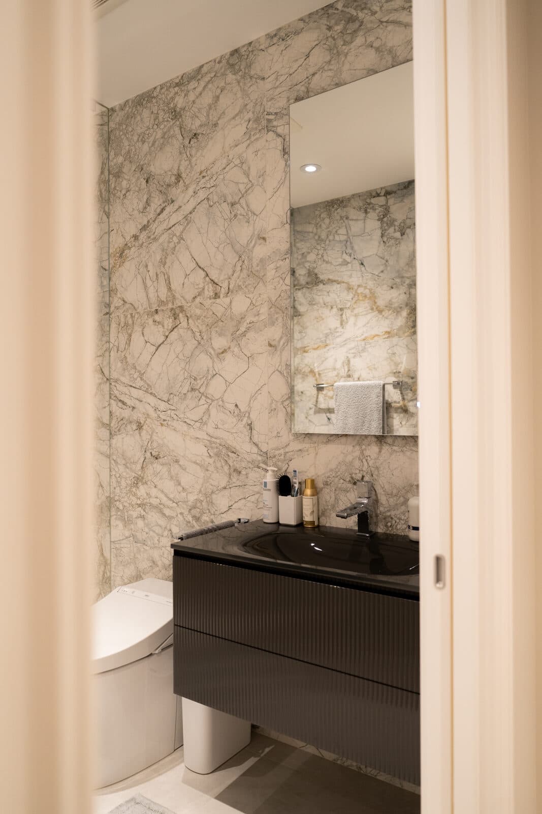 Powder room seen through a pocket door